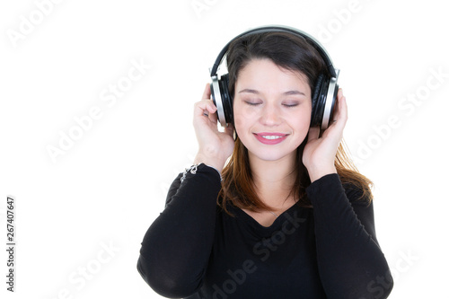 closed eyes young beautiful woman enjoying with listening the music