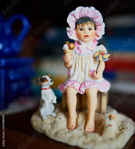 Ceramic girl with ice cream and dog