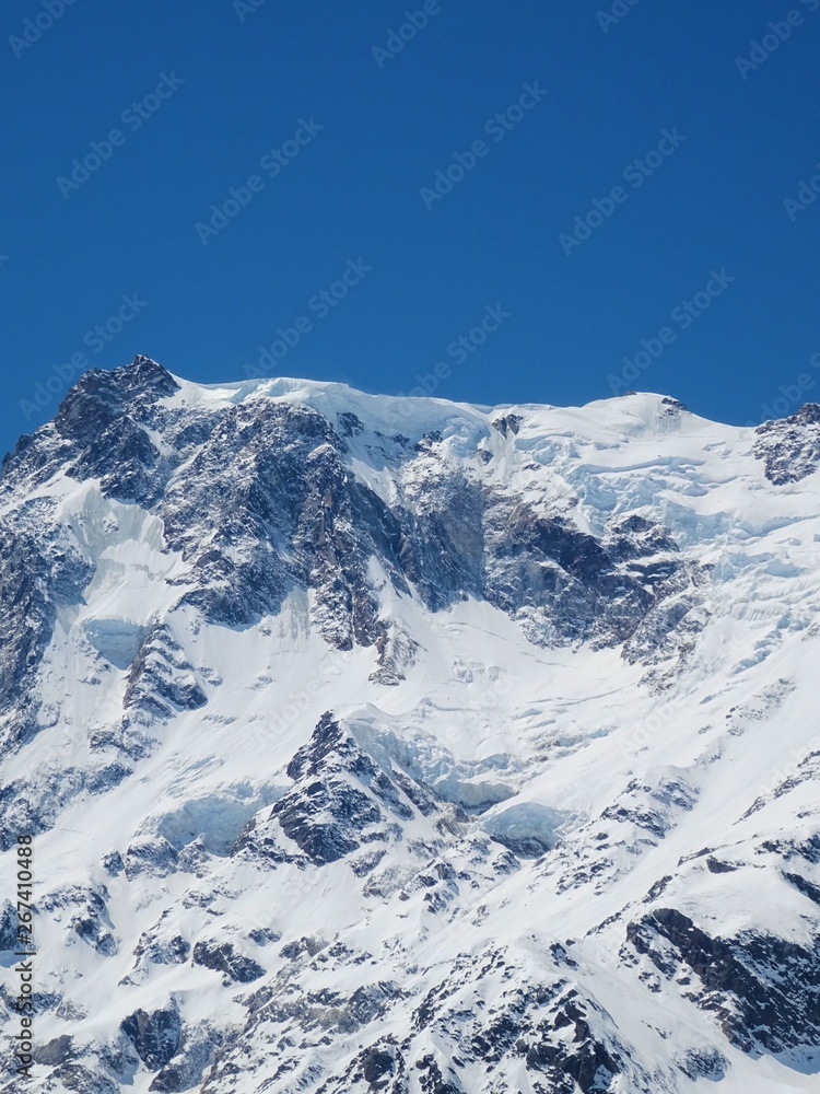 View of Monte Rosa on a sunny day near the village of Macugnaga, Italy - April 2019