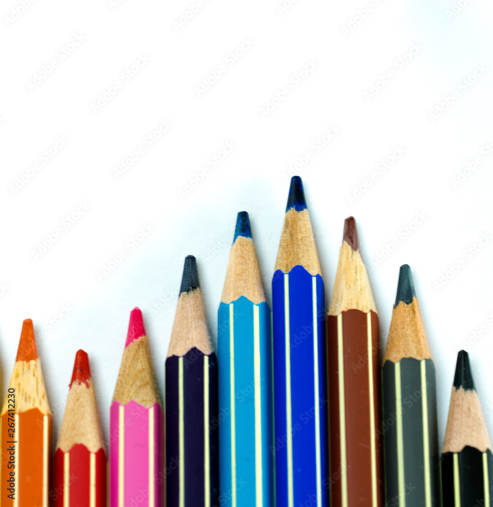 waves of colored pencils on a white background waves of colored pencils on a white background