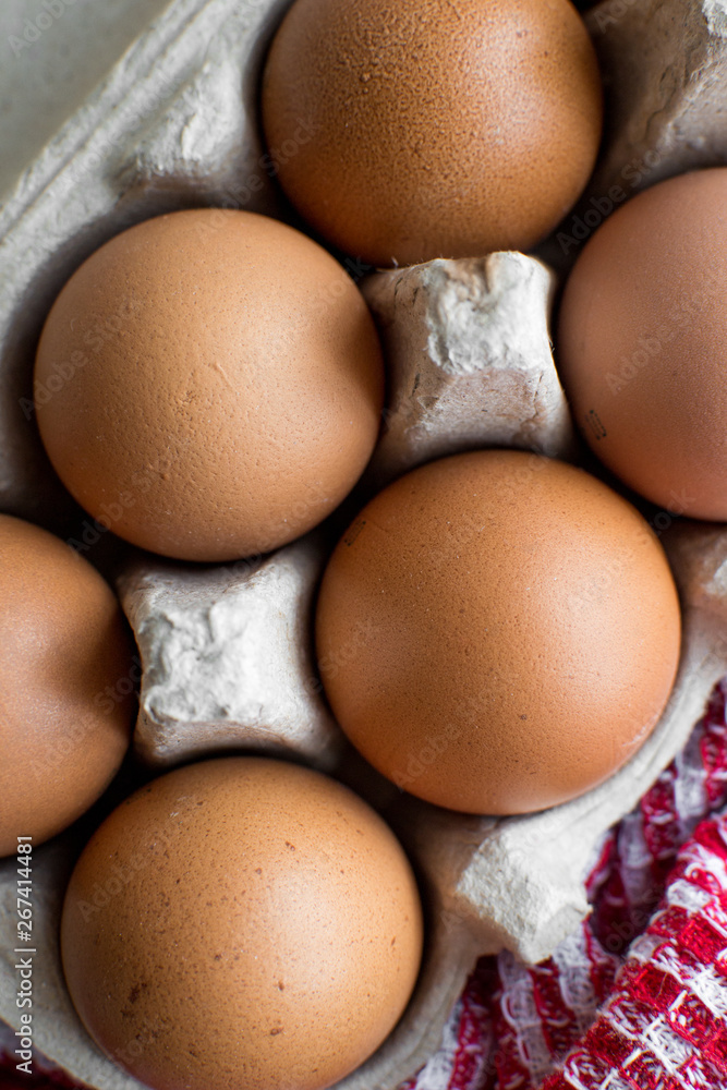 Chicken eggs in the carton. Close-up. Top view. Chicken eggs in the carton. Close-up. Top view.