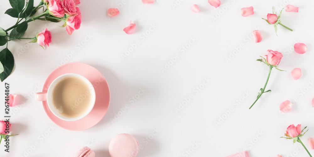 Flowers composition romantic. Flowers roses and rose petals, macaroon, cup coffee on white background. Happy women's day. Valentine's Day. Flat lay, top view 
