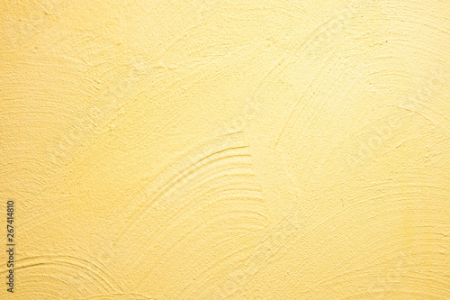 abstrakter, strukturierter Hintergrund: gelber Putz