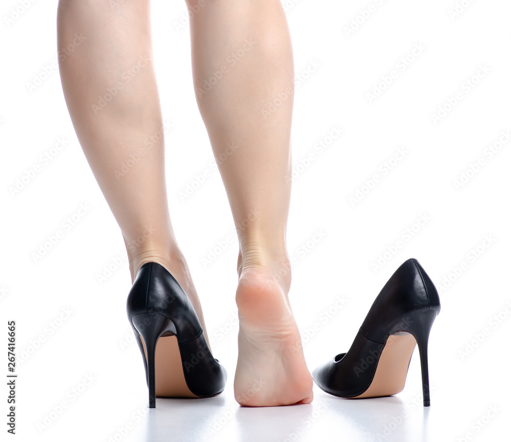 Female legs black high heels pain on white background isolation Female legs black high heels pain on white background isolation