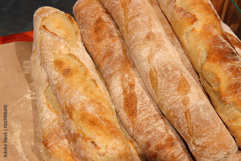Loaf of bread. Many fresh baguettes. Baguettes from bakery. Loaf of bread. Many fresh baguettes. Baguettes from bakery.
