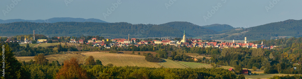 Colorful panorama of Bystrzyca Klodzka on the background of a mountain range.