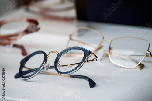 closeup of eyeglasses collection in store showroom photo