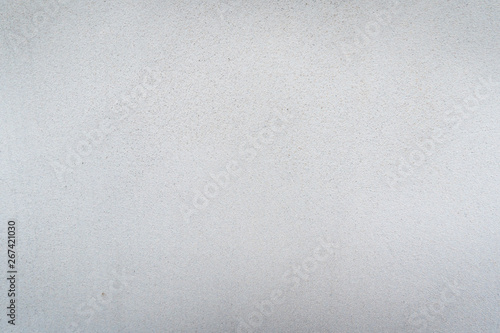 Texture of concrete wall surface painted with white color. Suitable for use as a pattern or background image for use in graphic design.