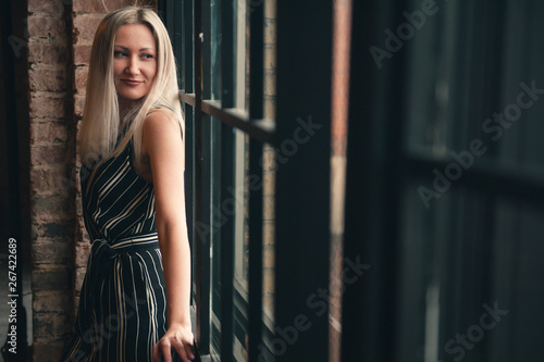 smilling young woman at the window