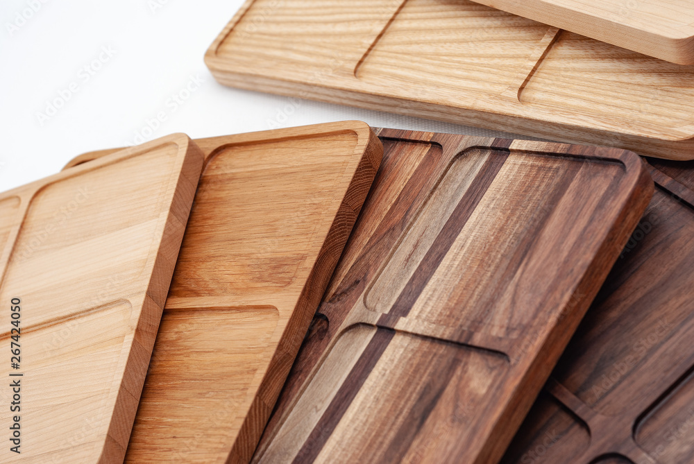 Shaped wooden boards in row on white background