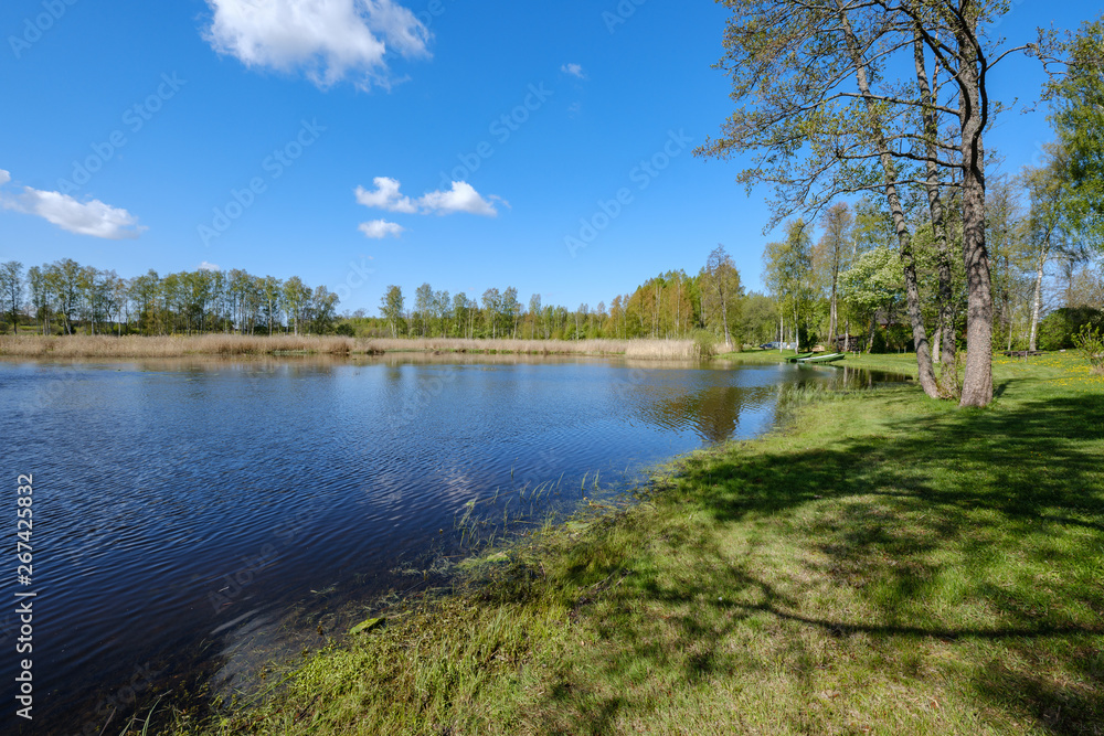 recreation camping area by the blue lake in sunny summer day recreation camping area by the blue lake in sunny summer day