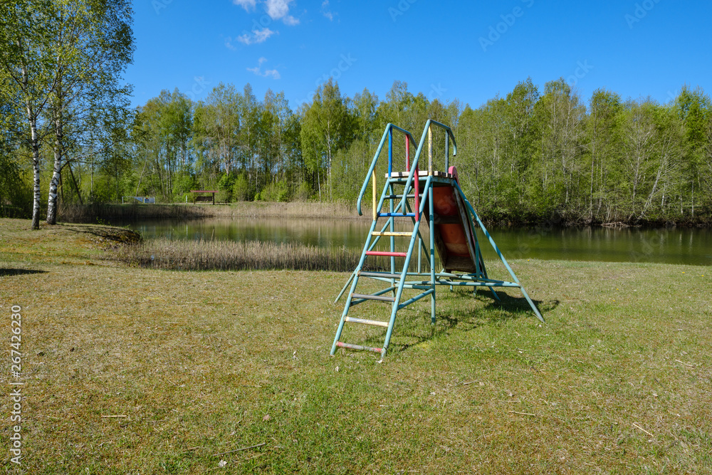 recreation camping area by the blue lake in sunny summer day
