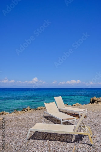 parasol made of reeds with the sea in the background a sunny summer day