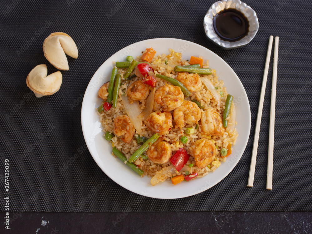 Shrimps with Rice and Vegetables Cantonese Style on a White Plate with Soy Sauce Shrimps with Rice and Vegetables Cantonese Style on a White Plate with Soy Sauce