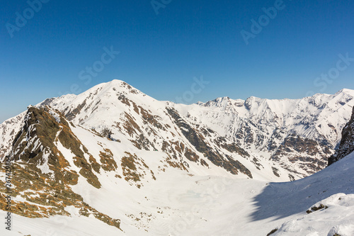 winter landscape with the mountain peaks covered by heavy snow. aerial view by drone. romanian mountains, Negoiu peak, Fagaras Mountains