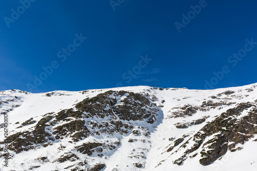 winter landscape with the mountain peaks covered by heavy snow. aerial view by drone. romanian mountains, Negoiu peak, Fagaras Mountains