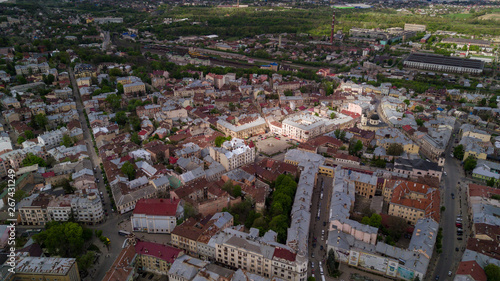 Aerial summer view of central part of beautiful ancient ukrainian city Chernivtsi with its streets, old residential buildings, town hall, churches etc. Beautiful town. UNESCO world heritage site.