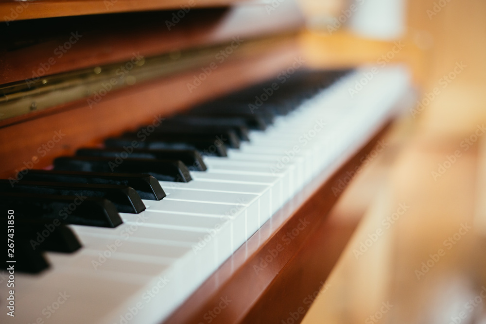Rustic piano: close up picture of classical piano keys, selective focus