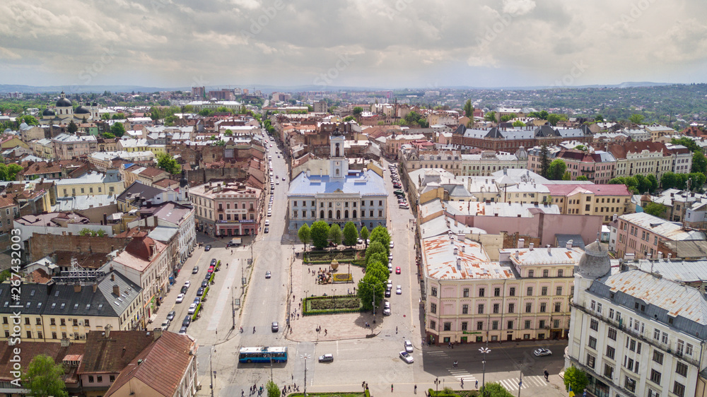 Aerial summer view of central part of beautiful ancient ukrainian city Chernivtsi with its streets, old residential buildings, town hall, churches etc. Beautiful town. UNESCO world heritage site.