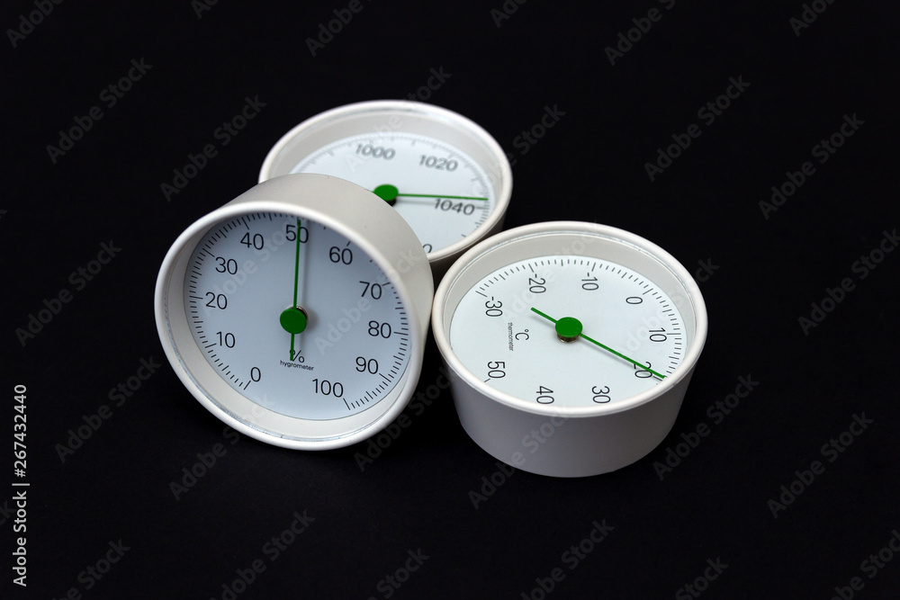 Barometer, thermometer, hygrometer isolated on black background. Barometer, thermometer, hygrometer isolated on black background.