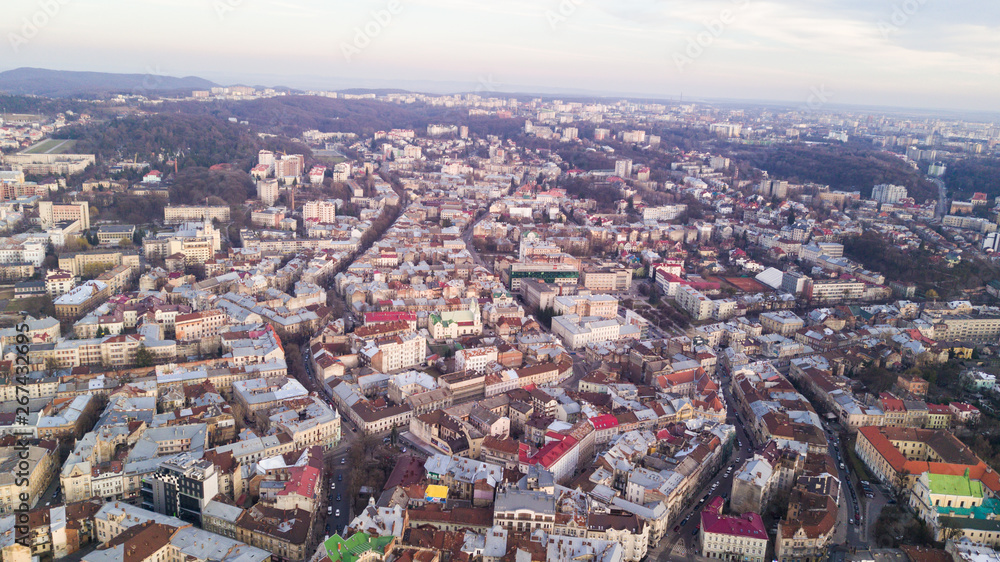 Rooftops of the old town in Lviv in Ukraine during the day. The magical atmosphere of the European city. Landmark, the city hall and the main square. Aerial view.