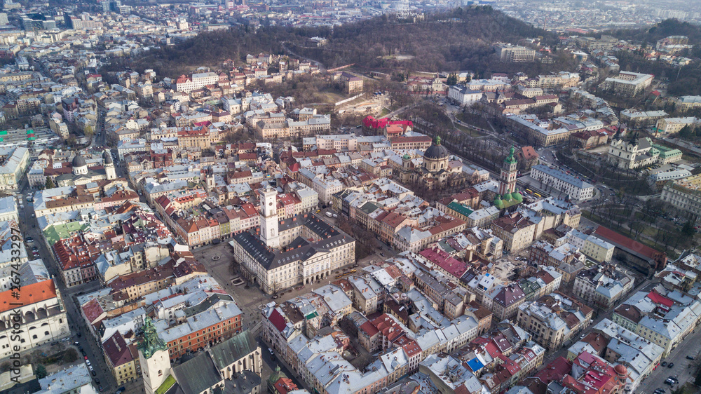 Obraz premium Rooftops of the old town in Lviv in Ukraine during the day. The magical atmosphere of the European city. Landmark, the city hall and the main square.