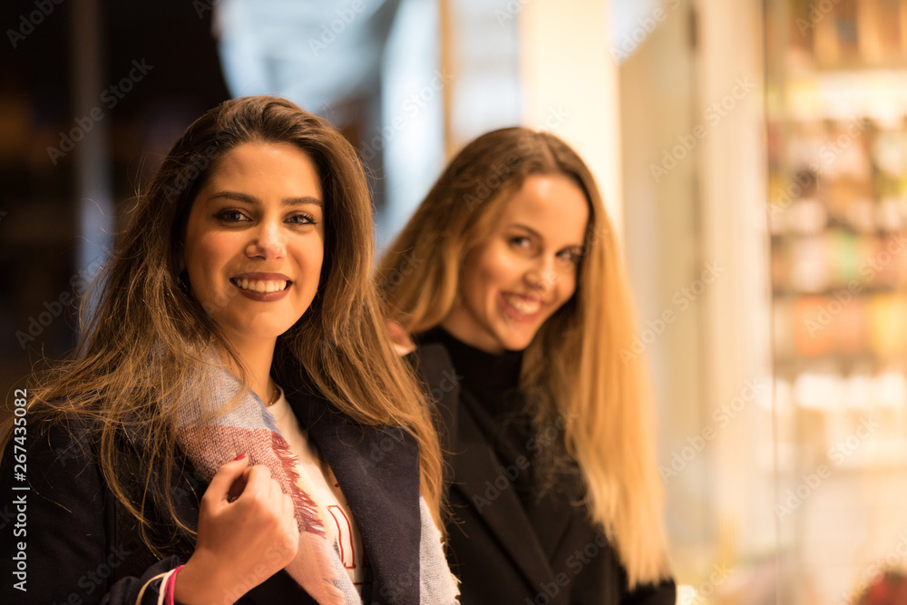 Happy young women with shopping