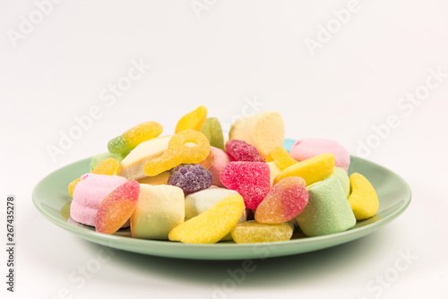 Plate with sweets isolated on a white background. Marmalade and marshmallow.