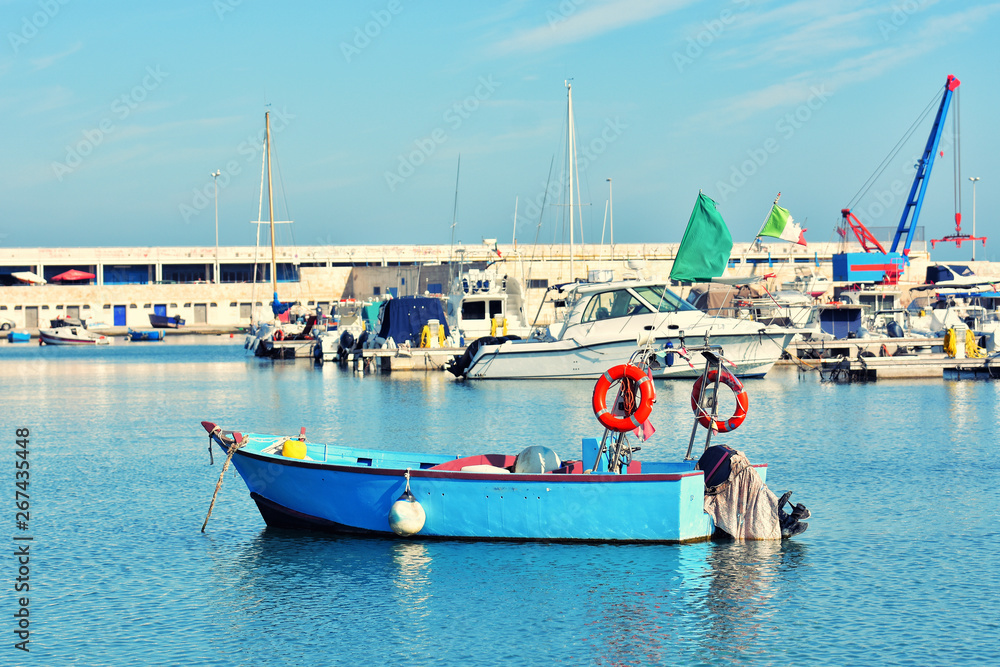 Obraz premium Fishing boats in the old harbor of Bari on the Adriatic sea coast, Puglia region, Italy. 