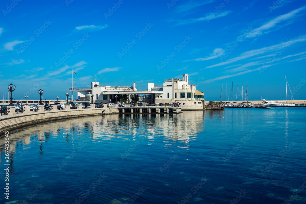 Blue landscape with lungomare promenade in the  old harbor of Bari on the Adriatic sea coast, Puglia region, Italy. 