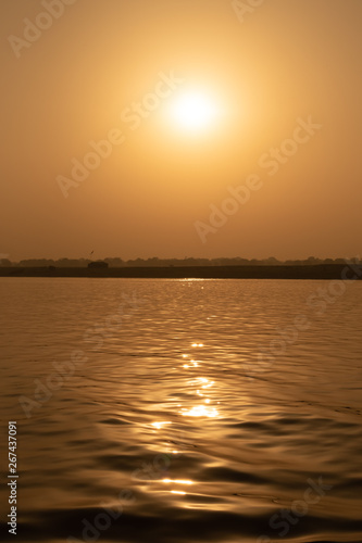 Sunrise at Ganga River with people ride a boats, Varanasi, India