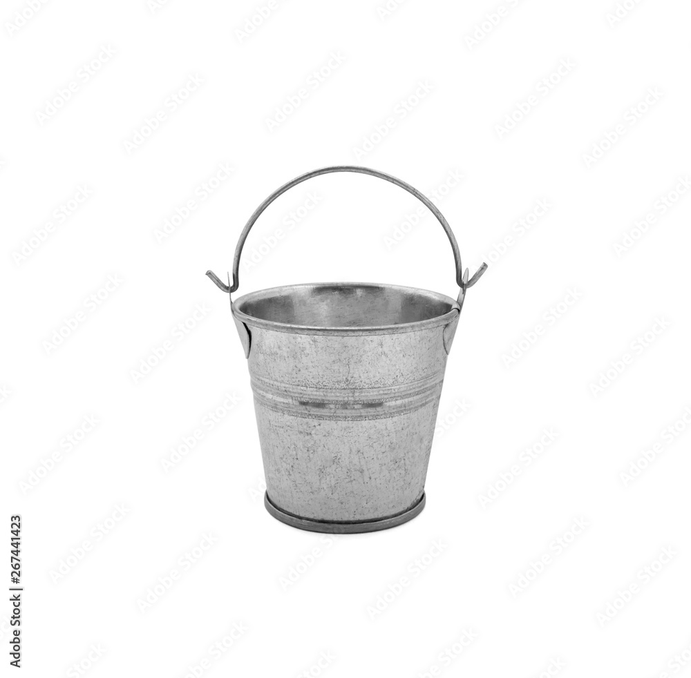 Photo of little metalic bucket isolated on a white background Photo of little metalic bucket isolated on a white background