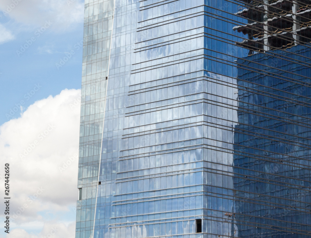 Fototapeta premium Office building construction. Mirror windows.