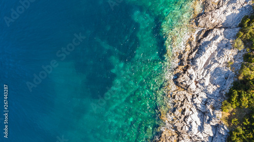 Spectacular aerial sea landscape of rocky coast and crystal clear water. © anzebizjan