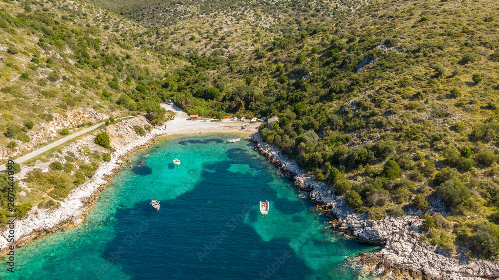 Spectacular aerial sea landscape of rocky coast and crystal clear water.