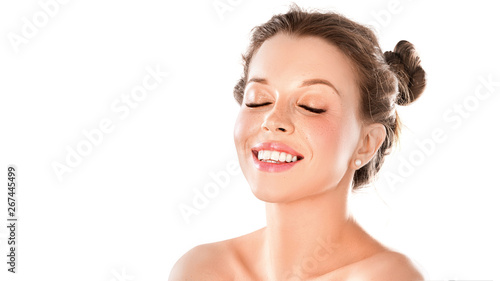 Portrait of a smiley woman with closed eyes isolated on white background. Healthy shining skin, teeth health and natural beauty concept