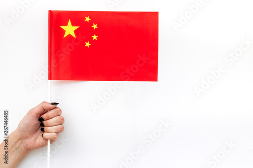Flag of China in hand on white background top view © 9dreamstudio
