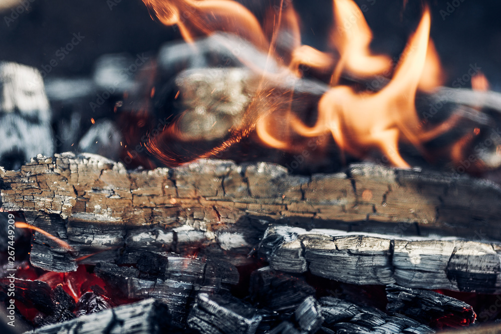 the dying fire, burning firewood, embers of a dying fire the dying fire, burning firewood, embers of a dying fire