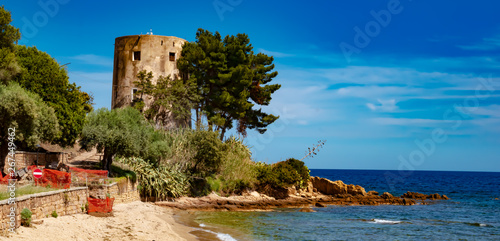 Sardinia, Italy - The historic old lighthouse, near Santa Maria Navarrese, in the province of Ogliastra, is a popular tourist spot, on the east coast of the island of Sardinia.