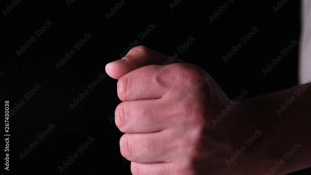 In slow motion on a black background, salt (flour) is strewed from one hand. Concept of: Time, Kitchen, Life, Hand, Crystal, Crystal Salt. In slow motion on a black background, salt (flour) is strewed from one hand. Concept of: Time, Kitchen, Life, Hand, Crystal, Crystal Salt.