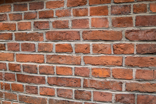 Background/Wallpaper/Textures - Orange and yellow bricks in a brick wall.