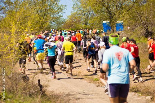 Krivoy Rog, Ukraine - 21 April, 2019: Marathon running race people competing in fitness and healthy active lifestyle feet on road