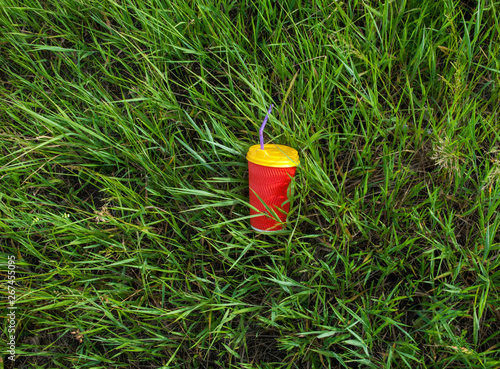 Plastic cup in the grass