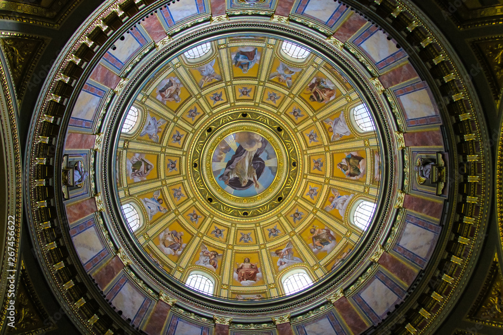 Beautiful paintings on the ancient dome of the famous Basilica of St. Stephen in Budapest, Hungary. Antique painting in Catholic church