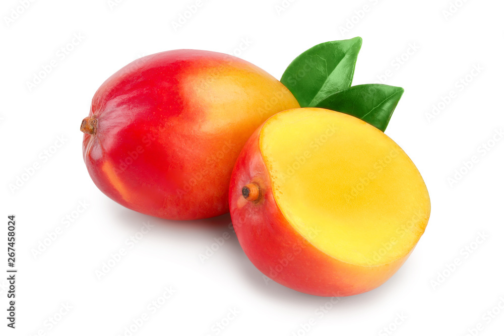 Mango fruit half with leaves and slices isolated on white background close-up Mango fruit half with leaves and slices isolated on white background close-up