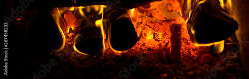 Firewood in the fire on black background