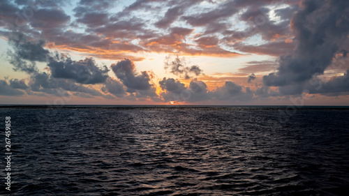 Sun sets over Tubbataha North Atoll. The Tubbataha Reef Marine Park is UNESCO World Heritage Site in the middle of Sulu Sea, Philippines.