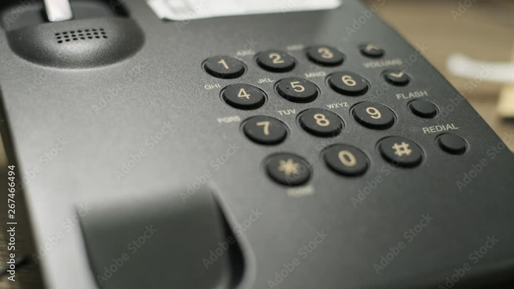 Male hand dials emergency number on the phone Male hand dials emergency number on the phone