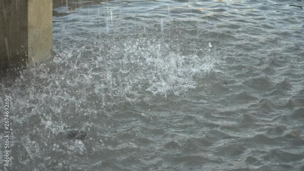 Rain splashes of the fountain in the basin. Background with the water drops. Rain splashes of the fountain in the basin. Background with the water drops.