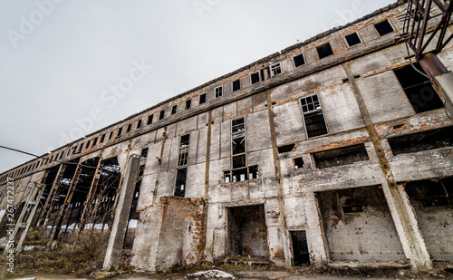 Abandoned building. Old factory ruin and broken windows. © Vadim